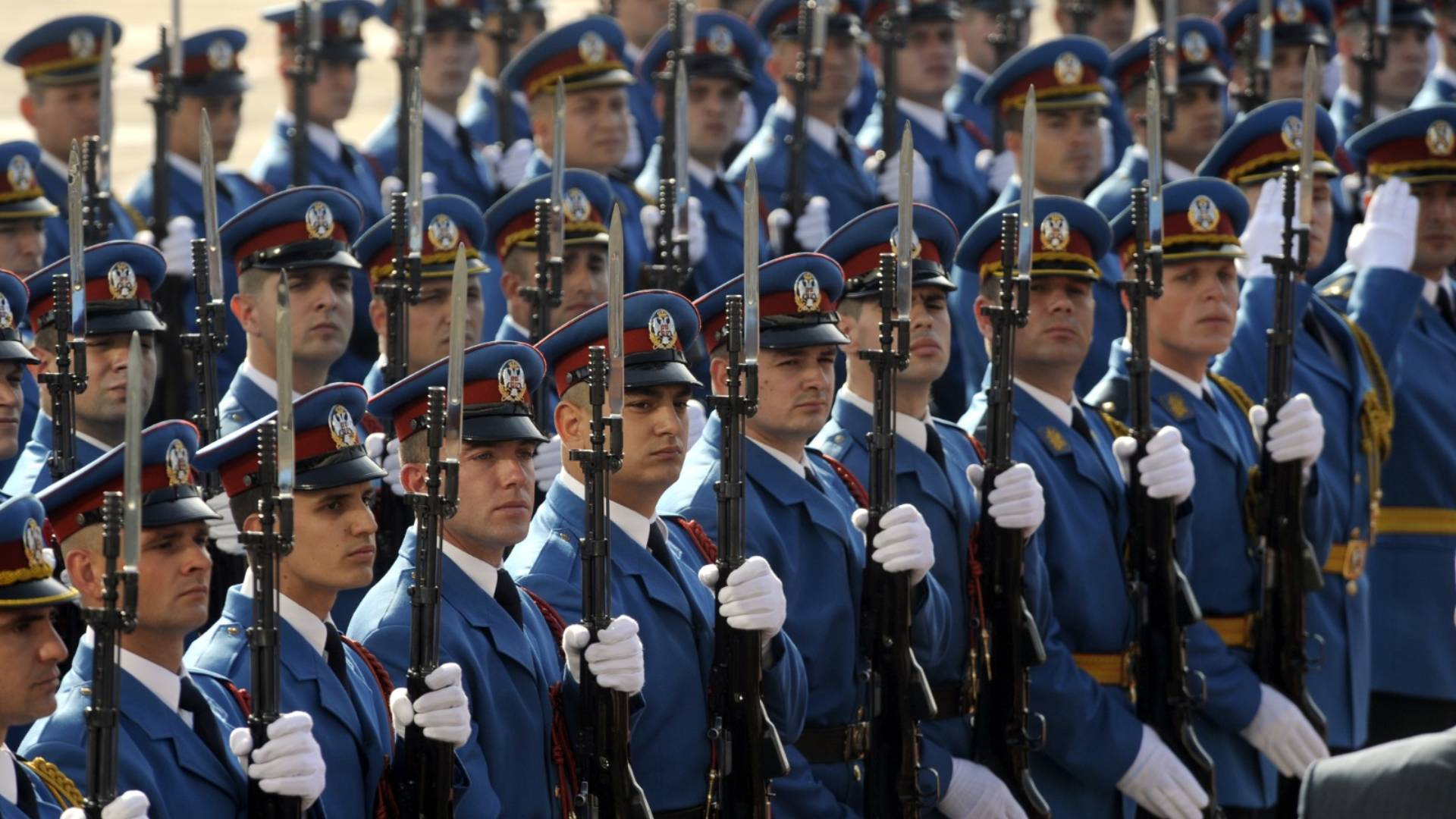 An honor guard marching in Uniforms Fashion tailored ceremonial dress uniforms with gold braid